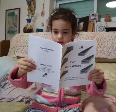Israeli student reading an English booklet